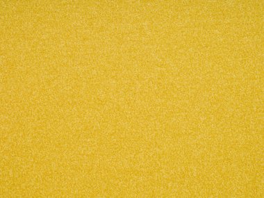 Canlı sarı bir doku görüntüye yayılır, sıcaklık, neşe ve bir limon yaz gününün lezzeti yayılır.