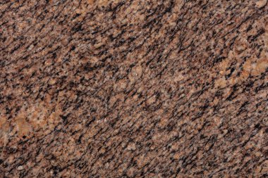 Giallo California Granit zemin, yeni tasarımının bir parçası olarak kahverengi tonda doku..