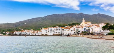 Sea landscape with Cadaques, Catalonia, Spain near of Barcelona. Scenic old town with nice beach and clear blue water in bay. Famous tourist destination in Costa Brava with Salvador Dali landmark clipart