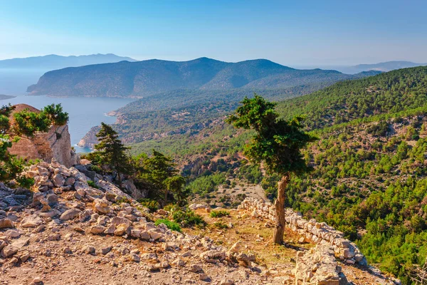 stock image Sea skyview landscape photo from ruins of Monolithos castle on Rhodes island, Dodecanese, Greece. Panorama with green mountains and clear blue water. Famous tourist destination in South Europe