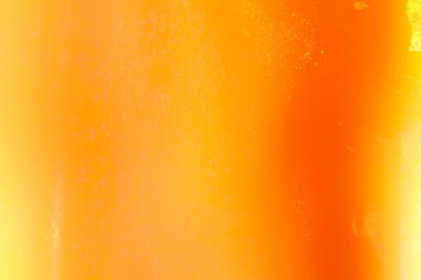 İçinde baloncuklar olan parlak turuncu bir arka plan. Kabarcıklar arka planda dağılmış, bir hareket ve enerji hissi yaratıyor. Arkaplanın turuncu rengi