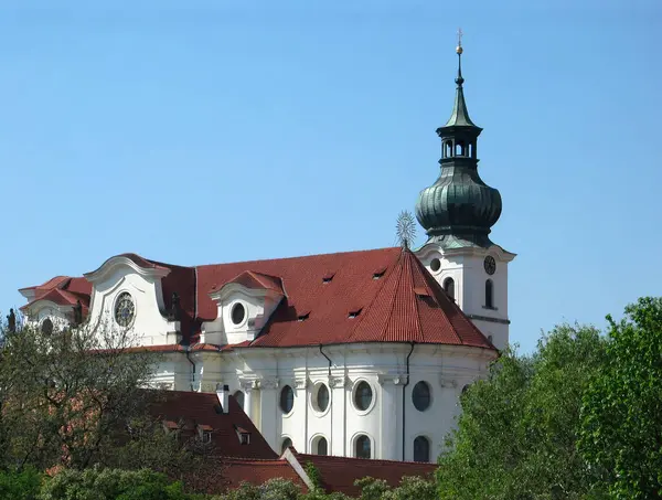 stock image The beautiful architecture of the dominant Brevnov Monastery. Monastery church seat of male monks in the capital city of Prague, Europe, state of the Czech Republic.