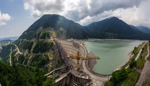 stock image The Enguri hydroelectric power station HES. The wide Inguri River Jvari Reservoir next to Enguri Dam, surrounded by mountains, Upper Svaneti, Georgia. Second highest concrete arch dam in the world.