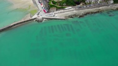 View of Cancale in Brittany, France, a city by the ocean. Drone view in 4k. Plage du Verger beach at Cancale, France. Famous place for oyster farms. 