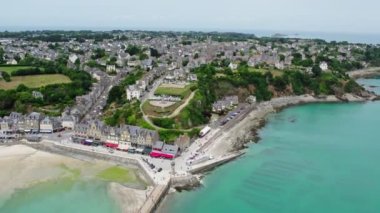 View of Cancale in Brittany, France, a city by the ocean. Drone view in 4k. Plage du Verger beach at Cancale, France. Famous place for oyster farms. 
