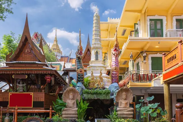 stock image Front view of Wat Chakkrawat Rachawat Woramahawihan Wat Sam Pluem, surrounded by blooming trees, Bangkok, Thailand