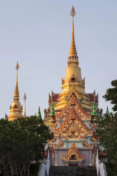 stock image The beautifully ornate Wat Thang Sai temple with golden spires and intricate details, set against a clear sky in Thailand