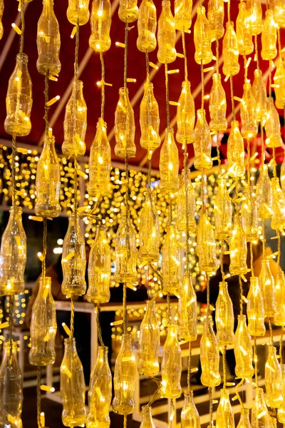 stock image Belgrade, Serbia - December 23, 2022: Coca Cola bottles with lights at exhibition stand in the streets of Belgrade on Christmas holidays at night 