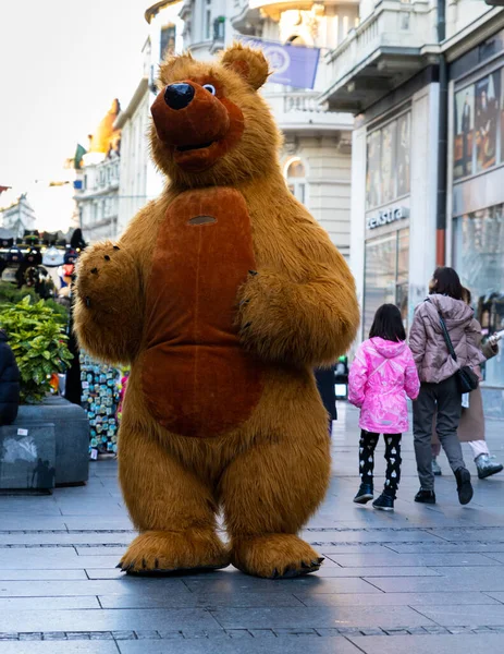 stock image Belgrade, Serbia - December 23, 2022: Man in a bear costume walking the street of Knez Mihailova during the Christmas holidays in Belgrade, Serbia