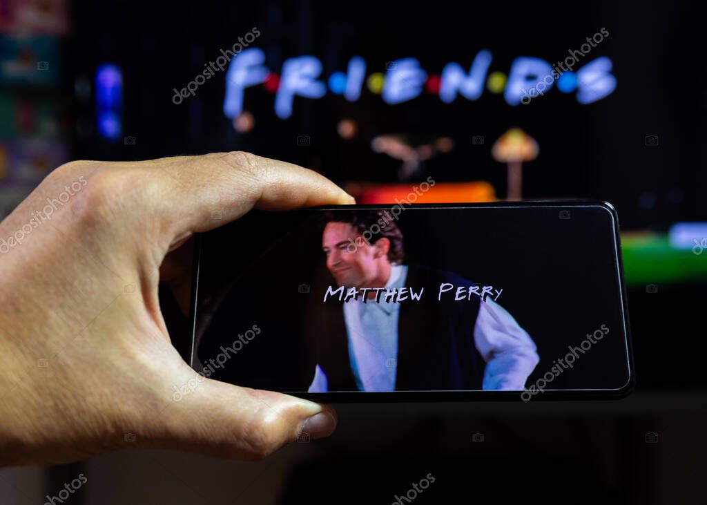Belgrade, Serbia - OCTOBER 30, 2023: Watching Friends tv show on HBO Max via Smartphone. An American comedy television sitcom. Dedicated to late Matthew Perry