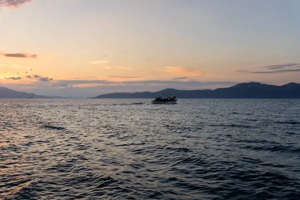 stock image Fishing Boat at sea in Evia island in Greece at sunset