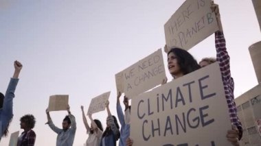 Group of demonstrators. Young people from a different culture and race fight for climate change is real, global warming and environmental conservation. High quality FullHD footage