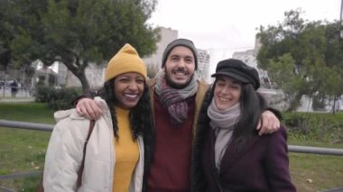 Portrait of a Happy people looking at camera. Winter vacations multi-ethnic friends. High quality 4k footage