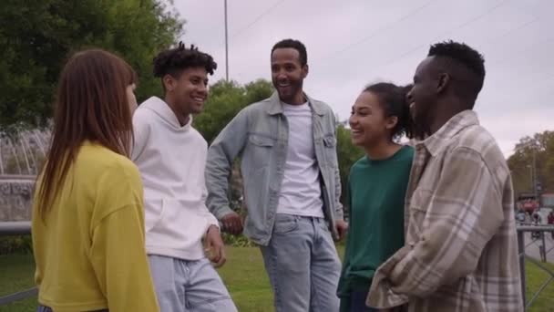 Young Group Happy Multiracial Friends Chatting Each Other Laughing Outdoors — Vídeo de stock