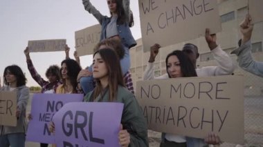 Group of activists demonstrating. People holding banners at a feminist protest. High quality FullHD footage