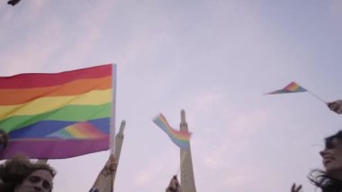 People celebrating Gay Pride waving Rainbow Flags. High quality FullHD footage