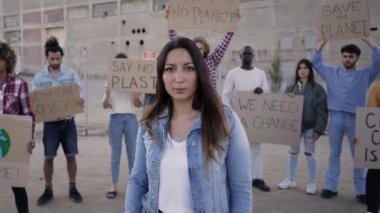 Woman in a Protest holding a Megaphone. There is No Planet B, Climate Change is Real, Go Vegan, Activist people... High quality FullHD footage