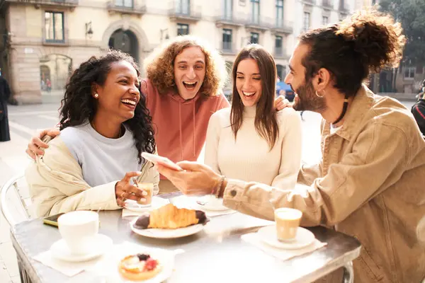 People group talking at coffee bar terrace. Friends having fun together at cafeteria on brunch time. Lifestyle concept with happy men and women at cafe venue. High quality photo
