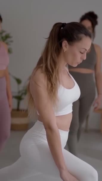 Vertical Professional Female Yoga Instructor Concentrating Helping Diverse Young Women — Stock Video