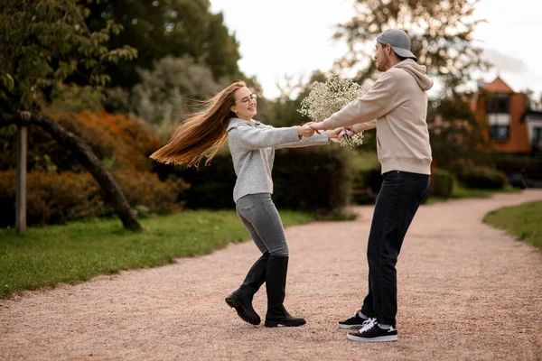 Young Cheerful Couple Love Man Woman Whirling Holding Hands Park — Stock Photo, Image