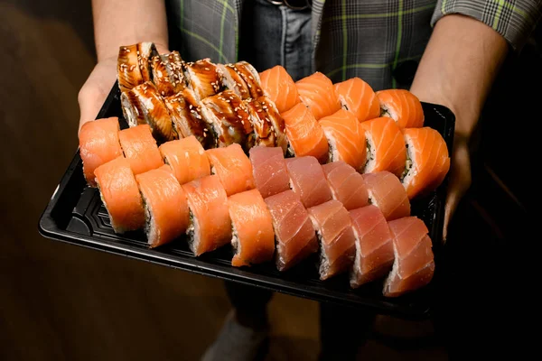 Sushi Sets Philadelphia Salmon Tuna Eel Black Box Male Hands — Stok fotoğraf