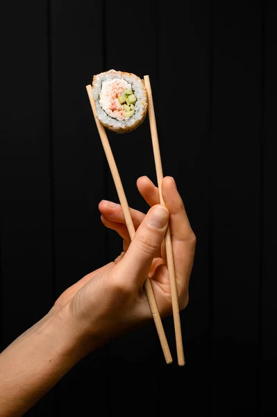 Female Hand Holding One Piece Roll California Snow Crab Meat — Stok fotoğraf