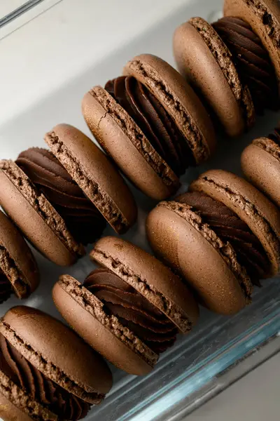 Cropped Close Photo Brown Macaroons Smeared Chocolate Cream Glass Container Stock Photo