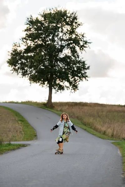 Enjoying Tranquil Distance Beautiful Girl Rides Her Longboard Gracefully Country Stock Photo