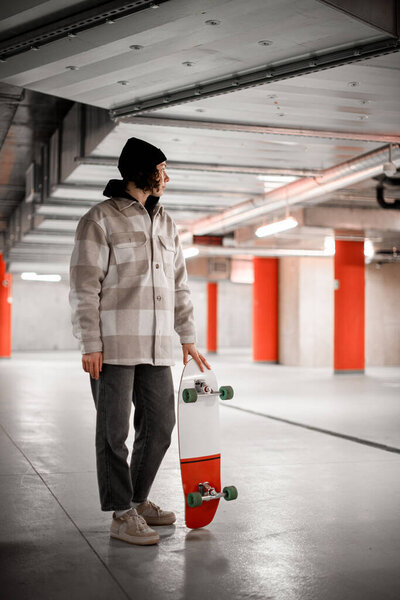 Young Woman Sportswear Looking Away Holding Skateboard Standing Floor Underground Stock Image
