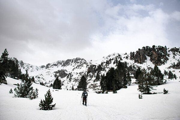 Back View Skier Moving Skis Plain Majestic Snow Capped Mountains Stock Photo