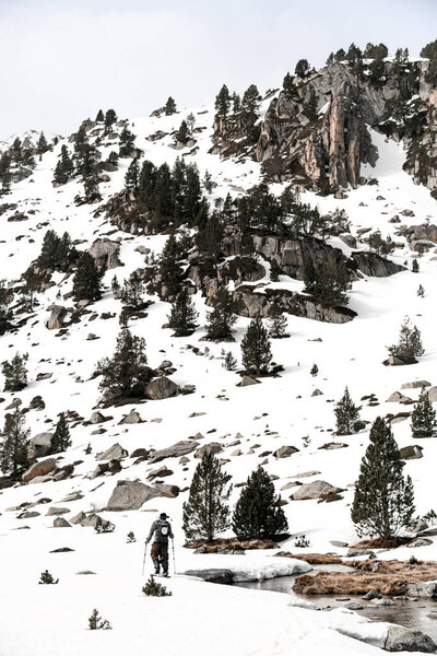 Distant View Skier Climbing Gentle Slope Next Thin Mountain Stream Stock Image