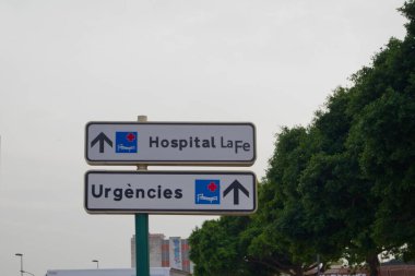 Close-up of the vertical traffic sign that indicates that the emergencies of the La Fe Hospital in Valencia, Spain are located in that direction