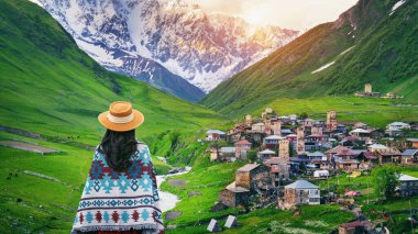 Tourist enjoy view of Ushguli village in Georgia.