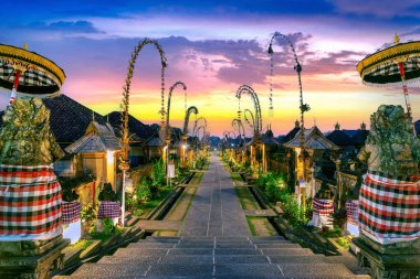 Penglipuran village is a traditional oldest Bali village at sunset in Bali, Indonesia. clipart