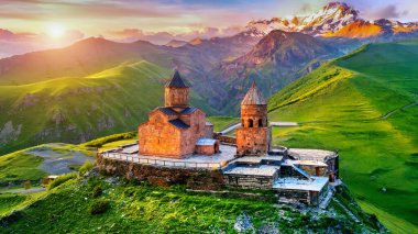 Aerial view of Gergeti trinity church at sunrise in Georgia.
