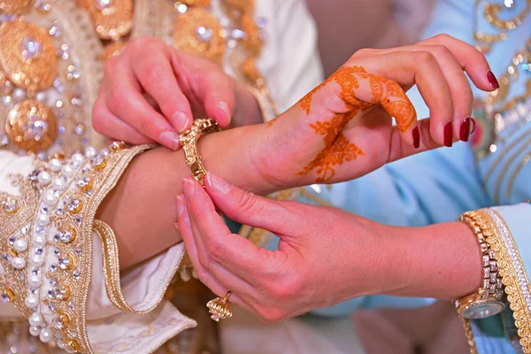 Close up of moroccan couples hands at a wedding, concept of marriage, moroccan wedding