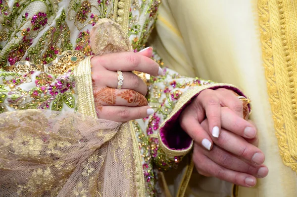Close up of moroccan couples hands at a wedding, concept of marriage, moroccan wedding