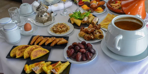 Moroccan breakfast in Ramadan. Harira soup. Dates, tea, juices and various sweets