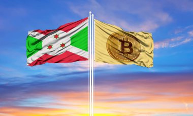 Bitcoin ve Burundi bayrak direkleri ve mavi gökyüzünde iki bayrak