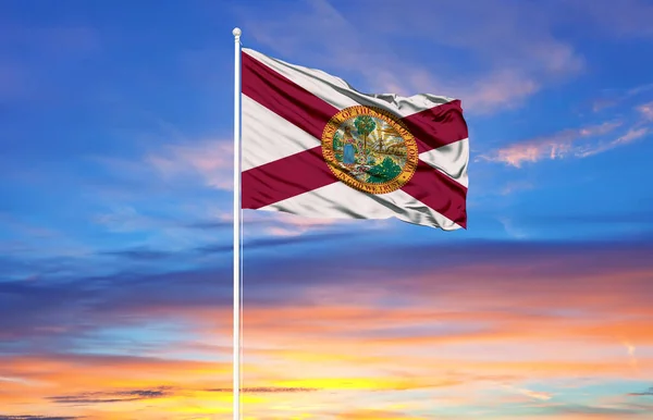 flag of Florida on flagpoles and blue sky. Patriotic concept about state.