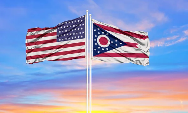 United States and Ohio two flags on flagpoles and blue sk