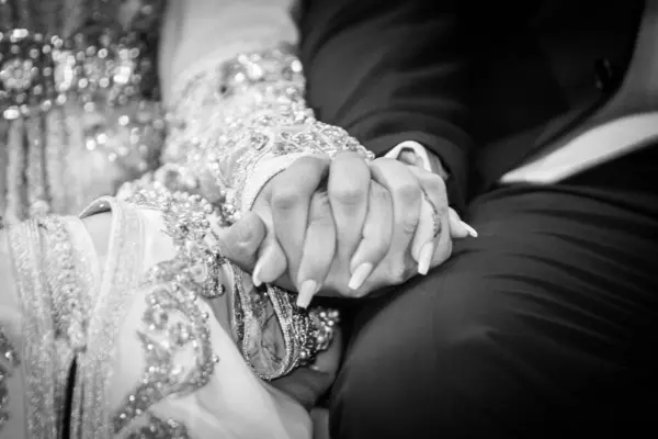 Close up of arabic couple\'s hands at a wedding