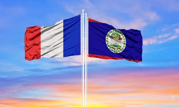 Franciaország Belize Két Zászlót Zászlórúdra Kék Felhős Égre Diplomáciai Koncepció — Stock Fotó