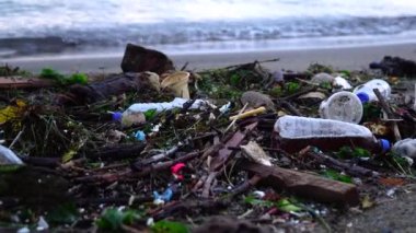 Plastic waste on beach. non-biodegradable waste on beach. Spilled garbage by the sea. Environmental pollution problem