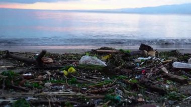 Plastic waste on beach. non-biodegradable waste on beach. Spilled garbage by the sea. Environmental pollution problem