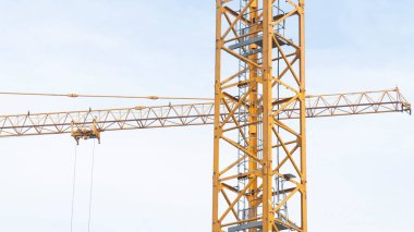 Construction crane at work on a busy building site.