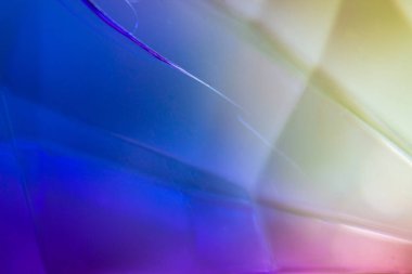 Abstract, blurry, and colorful glass with a vibrant and dynamic composition.