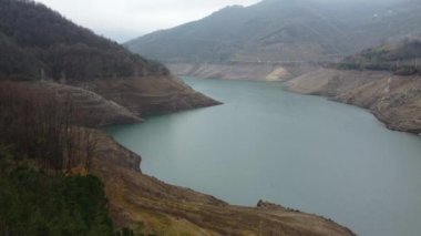 Aerial view of dam. Yuvacik Dam in Kocaeli Turkey. Low water level in dam due to climate change crisis. Water level in reservoirs