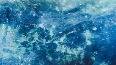 Aerial view of mucilage on the sea. Dirty sea with toxic poisonous waste. Sea snot. Selective focus. Noise and grain included