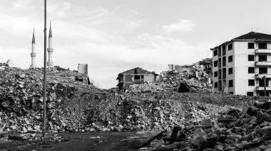 Earthquake damage in a city. Destroyed buildings after an earthquake. Collapsed buildings. Ruined city because of war. Airstrike damages a city. Urban transformation concept. Selective focus included